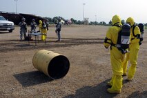 MINOT AIR FORCE BASE, N.D. -- 5th Civil Engineer Squadron explosive ordnance disposal members respond to an accident during a major accident response exercise here Aug. 5. The MARE simulated an event where multiple base agencies were tested on response time and capabilities. (U.S. Air Force photo by Airman 1st Class Aaron-Forrest Wainwright)
