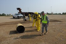 MINOT AIR FORCE BASE, N.D. -- 5th Civil Engineer Squadron explosive ordnance disposal members respond to an accident during a major accident response exercise here Aug. 5. The MARE simulated an event where multiple base agencies were tested on response time and capabilities. (U.S. Air Force photo by Airman 1st Class Aaron-Forrest Wainwright)
