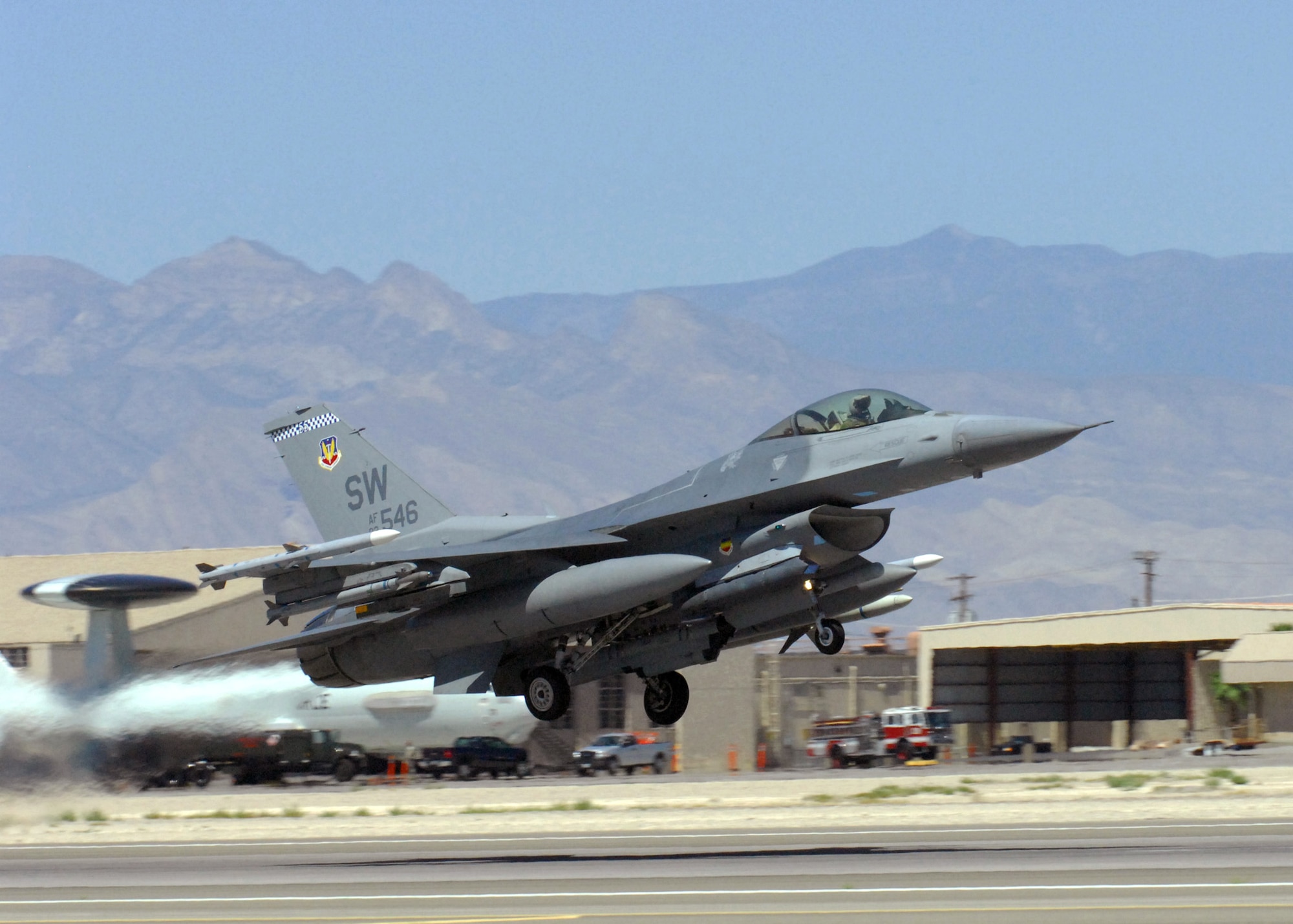 An F-16 Fighting Falcon from the 77th Fighter Squadron takes off from the runway for Exercise Red Flag July 21, 2010, at Nellis Air Force Base, Nev. Red Flag is a realistic combat training exercise involving the air forces of the U.S. and its allies. (U.S. Air Force photo/Airman 1st Class Daniel Phelps)