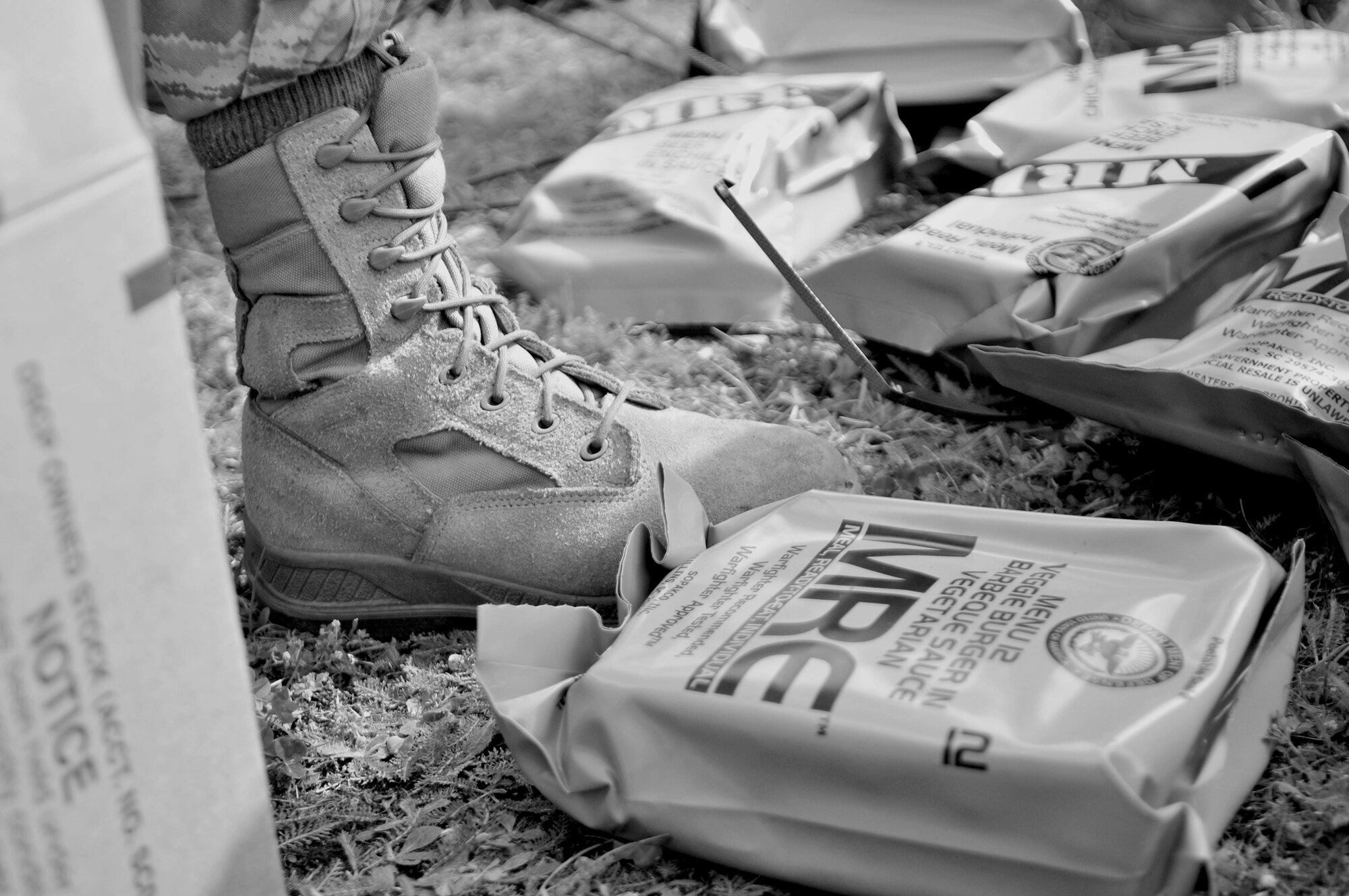 Medical technicians from the 86th Medical Group participating in a week of mobile aeromedical staging facility training take a few minutes for a Meal, Ready to Eat lunch Aug. 2, 2010, at Ramstein Air Base, Germany. (U.S. Air Force photo/Tech. Sgt. Michael Voss)
