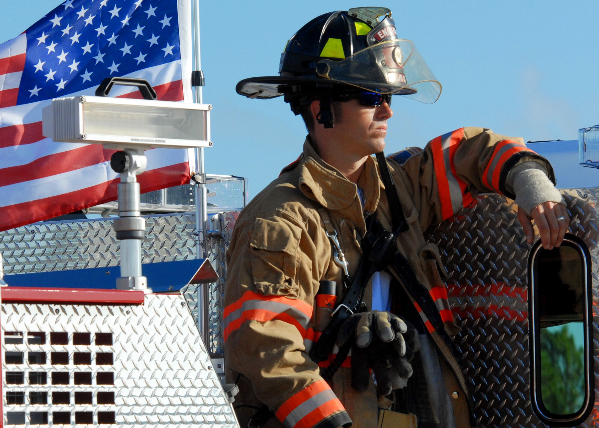 Dan Bye, 96th Civil Engineer Squadron, watches as the Nuclear Accident Response Exercise unfolds Aug. 11 at Eglin Air Force Base, Fla.  This exercise assessed the ability of base personnel to support a request from Department of Energy  and respond to a major accident. In the scenario, while securing the vehicles from a DoE convoy, the DoE truck experienced an engine fire and two DoE personnel suffered severe burns while trying to extinguish the fire. Emergency personnel responded to the situation, secured the scene, transported the victims and put out the fire.  (U.S. Air Force photo/Samuel King Jr.)
