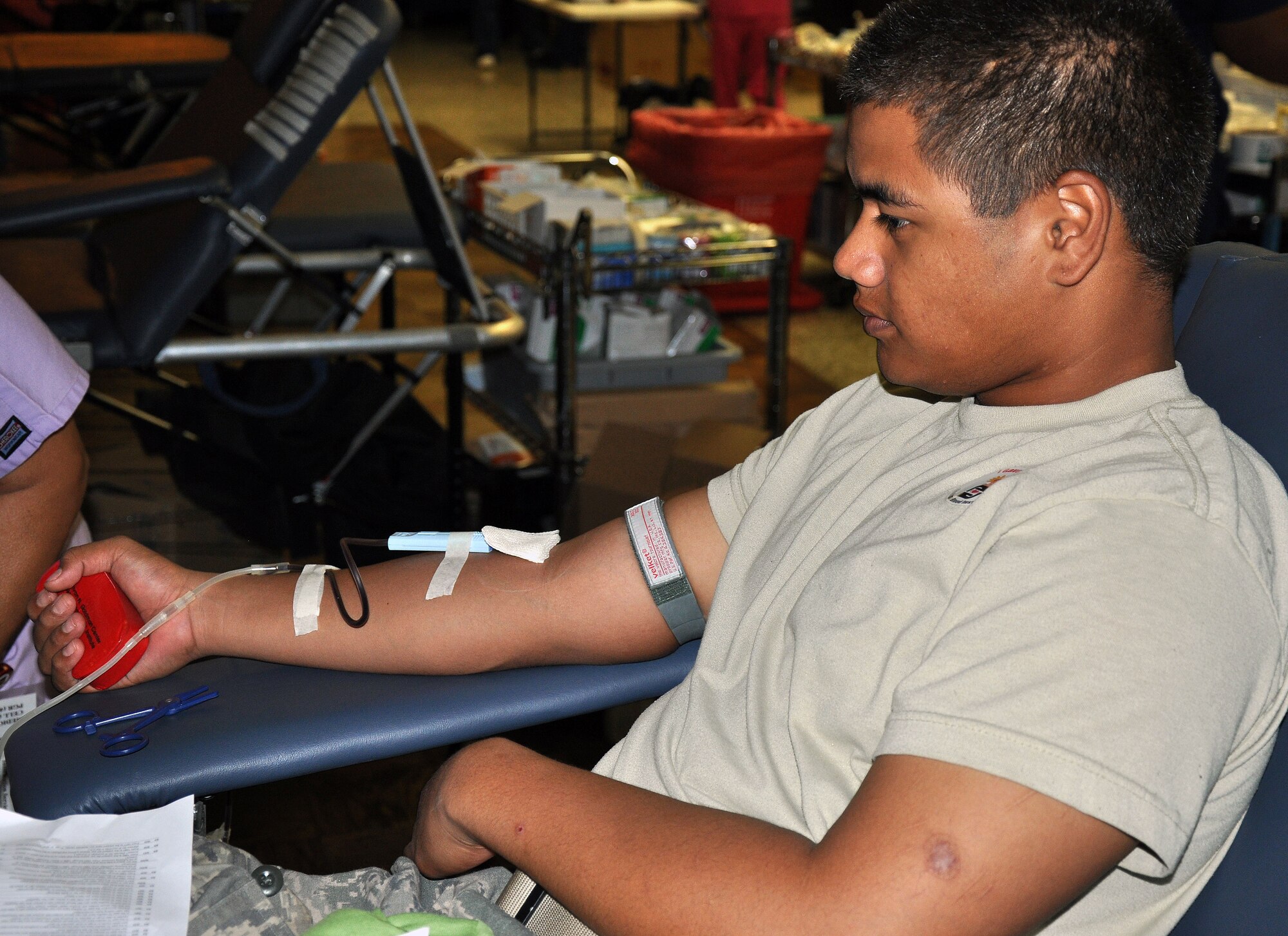 Airman Basic Marvin Satele, 361st Training Squadron student, gives blood at the Airman in Training Blood Drive Aug. 11 at Airman's Club at Sheppard Air Force Base, Texas.  The blood drive invited both instructors and students to volunteer to donate blood.  (U.S. Air Force photo/Tech. Sgt. Vernon Cunningham)