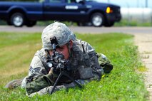 MINOT AIR FORCE BASE, N.D. -- Senior Airman Alexander Ballard, 5th Security Forces Squadron response force team member, provides security following an increase of Force Protection Condition during a major accident response exercise here Aug. 5. During heightened protection levels, security forces will be fighting to protect personnel and resources, and base residents can expect rigid security at base gates and immediate restrictions on their movements, such as being directed to stay home. (U.S. Air Force photo by Airman 1st Class Aaron-Forrest Wainwright)