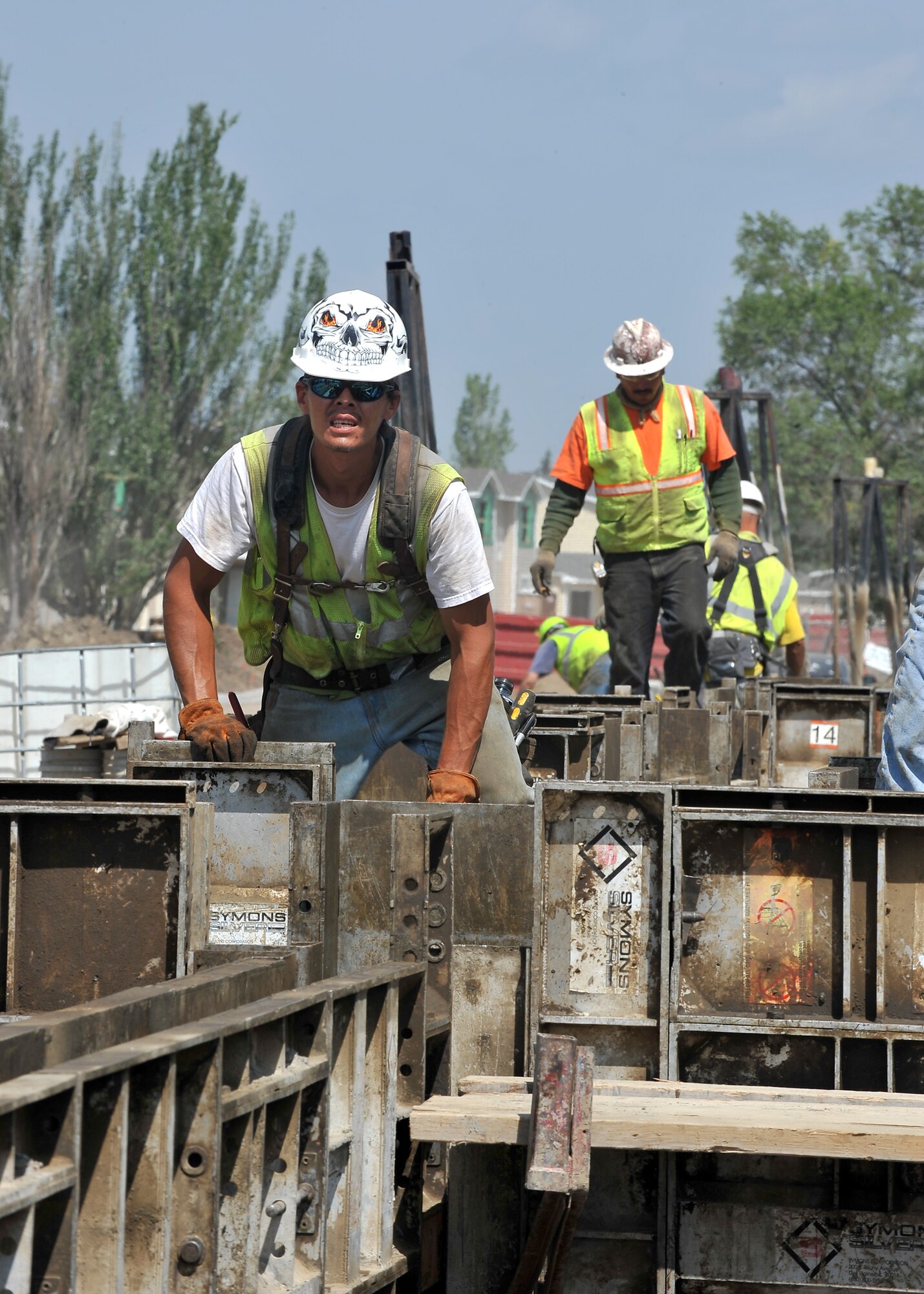 MINOT AIR FORCE BASE, N.D. -- John Rehak, a construction worker contracted by the 5th Civil Engineer Squadron, checks the alignment of the guide walls on a new foundation for the base housing project near Delta Drive here Aug. 6. The base housing expansion is aimed to help improve the comfort of living and decrease the shortage of homes for incoming service members. (U.S. Air Force photo by Senior Airman Michael J. Veloz)