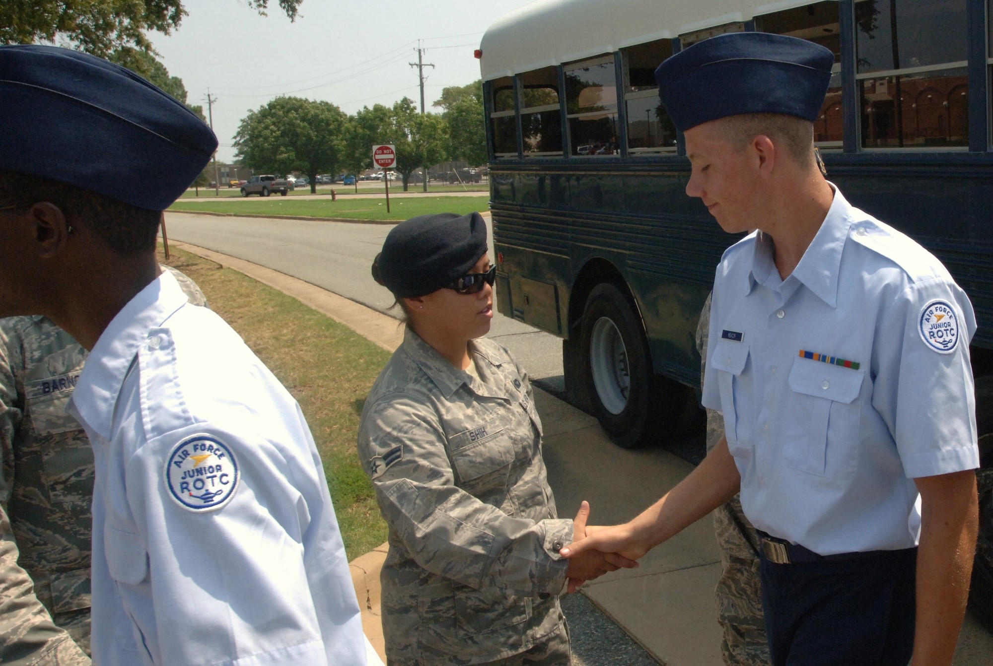 LANGLEY AIR FORCE BASE, Va. -- Airmen from the 633d Security Forces Squadron shake hands with Air Force Junior Reserve Officer Training Corps cadets following a tour of SFS facilities during “Shadow Day” Aug. 10. The event allowed more than 60 Hampton Roads-area cadets the opportunity to see the Air Force mission in action. (U.S. Air Force photo/Airman 1st Class Jason J. Brown)