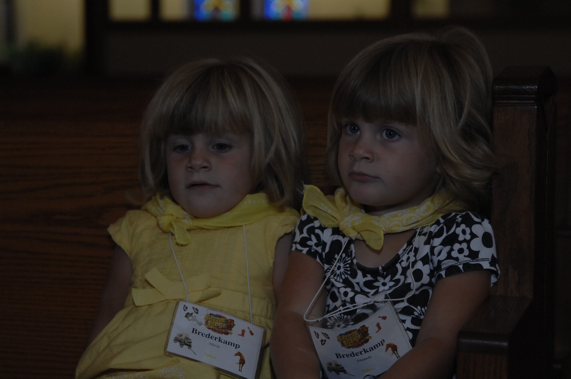 SCOTT AIR FORCE BASE, Ill. -- Amanda and Alivia Brenderkamp, both 3, wait patiently for Vacation Bible School to start.  VBS was open to children in preschool through 6th grade.