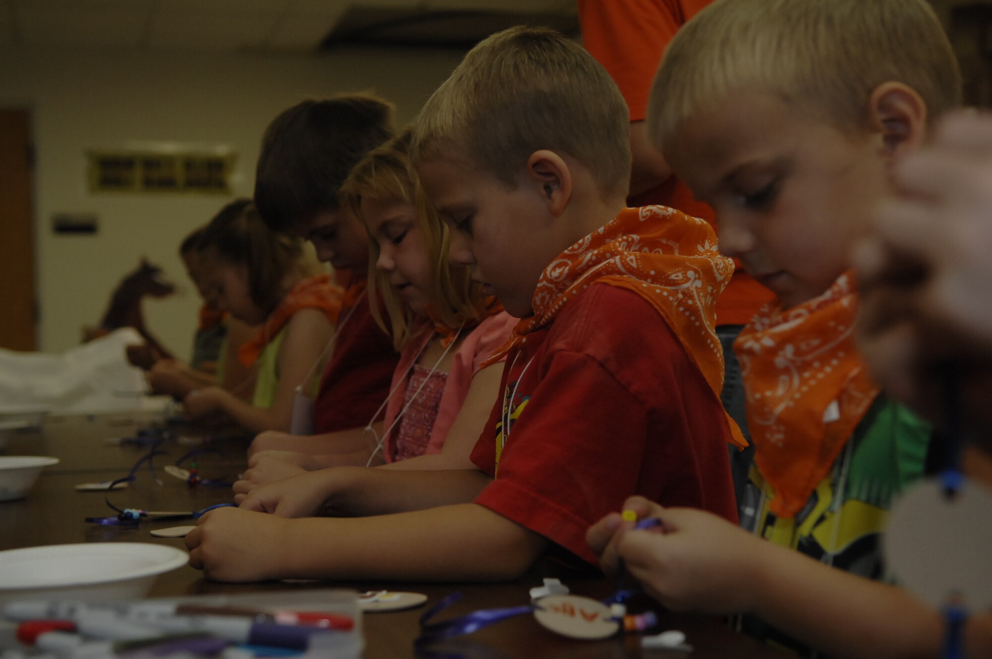 SCOTT AIR FORCE BASE, Ill. -- Children create arts and crafts at Vacation Bible School at the Scott Air Force Base Chapel Aug. 4.  They also took part in music, recreation, and Bible classes.  This year a new class, called missons, taught children about giving and helping others.