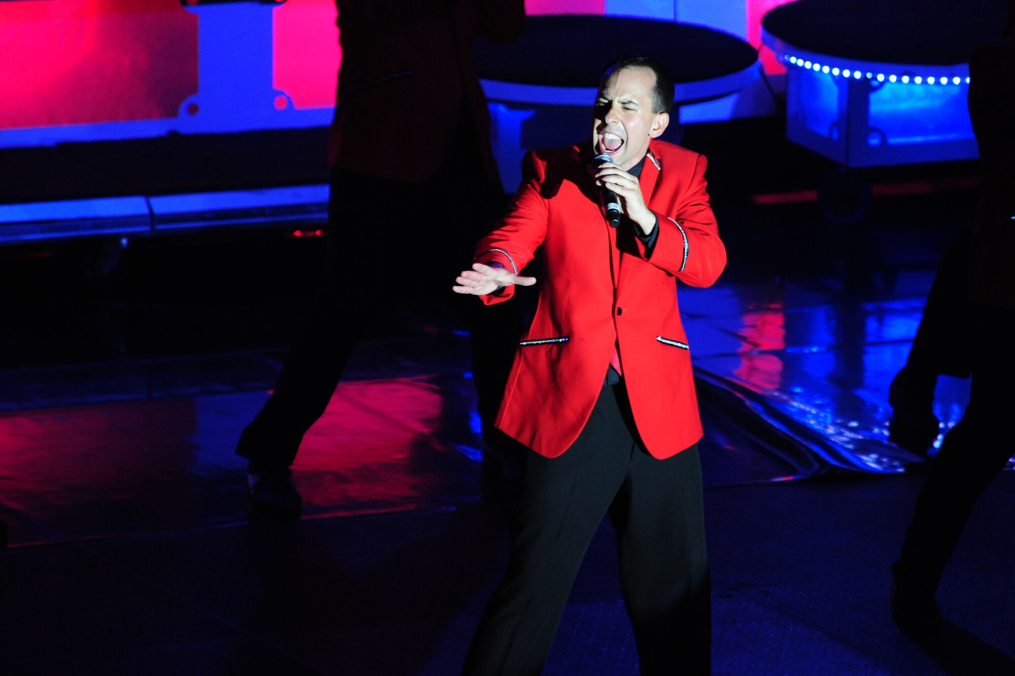 Senior Airman Devin Martin, 55th Strategic Communications Squadron cyberspace transport technician, performs “Don’t Stop Believing” in the Tops in Blue show at the Rushmore Plaza Civic Center in Rapid City, S.D., Aug. 8. This year Tops in Blue will tour throughout the United States and to more than 25 countries, with close to 140 performances over a 10-month period. (U.S. Air Force photo/Senior Airman Corey Hook)