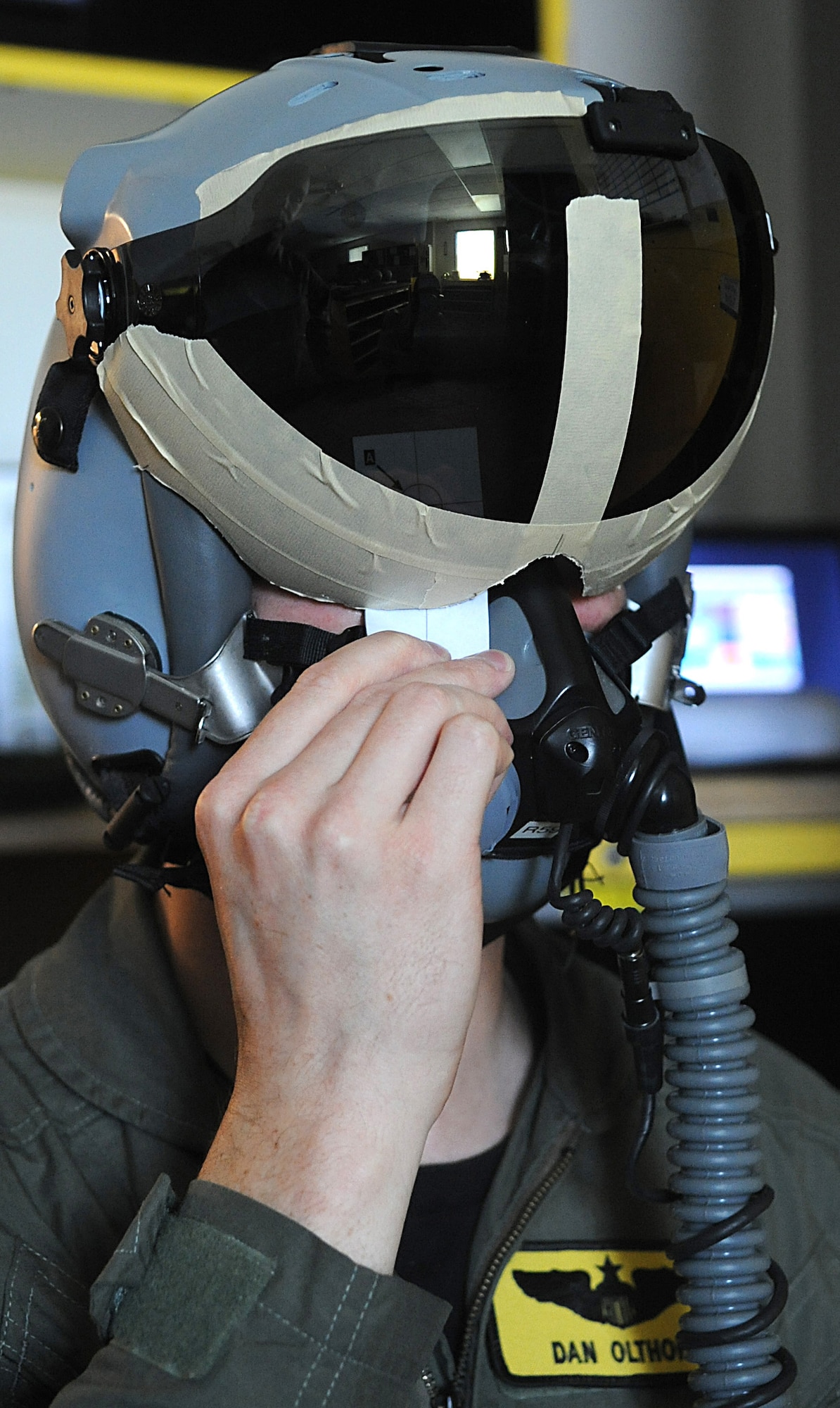 SEYMOUR JOHNSON AIR FORCE BASE, N.C. – Capt. Dan Olthoff completes a test that measures the distance between his pupils while wearing a Joint Helmet-Mounted Cueing System Aug. 9, 2010. Once measured, an image will display directly over the pilot’s pupil on the inside of the visor, highlighting the JHMCS ability to display cueing symbology for navigation, weapons and targeting sensors. Captain Olthoff, 336th Fighter Squadron F-15 E Strike Eagle pilot, is from Atlanta. (U.S. Air Force photo/Senior Airman Makenzie Lang)