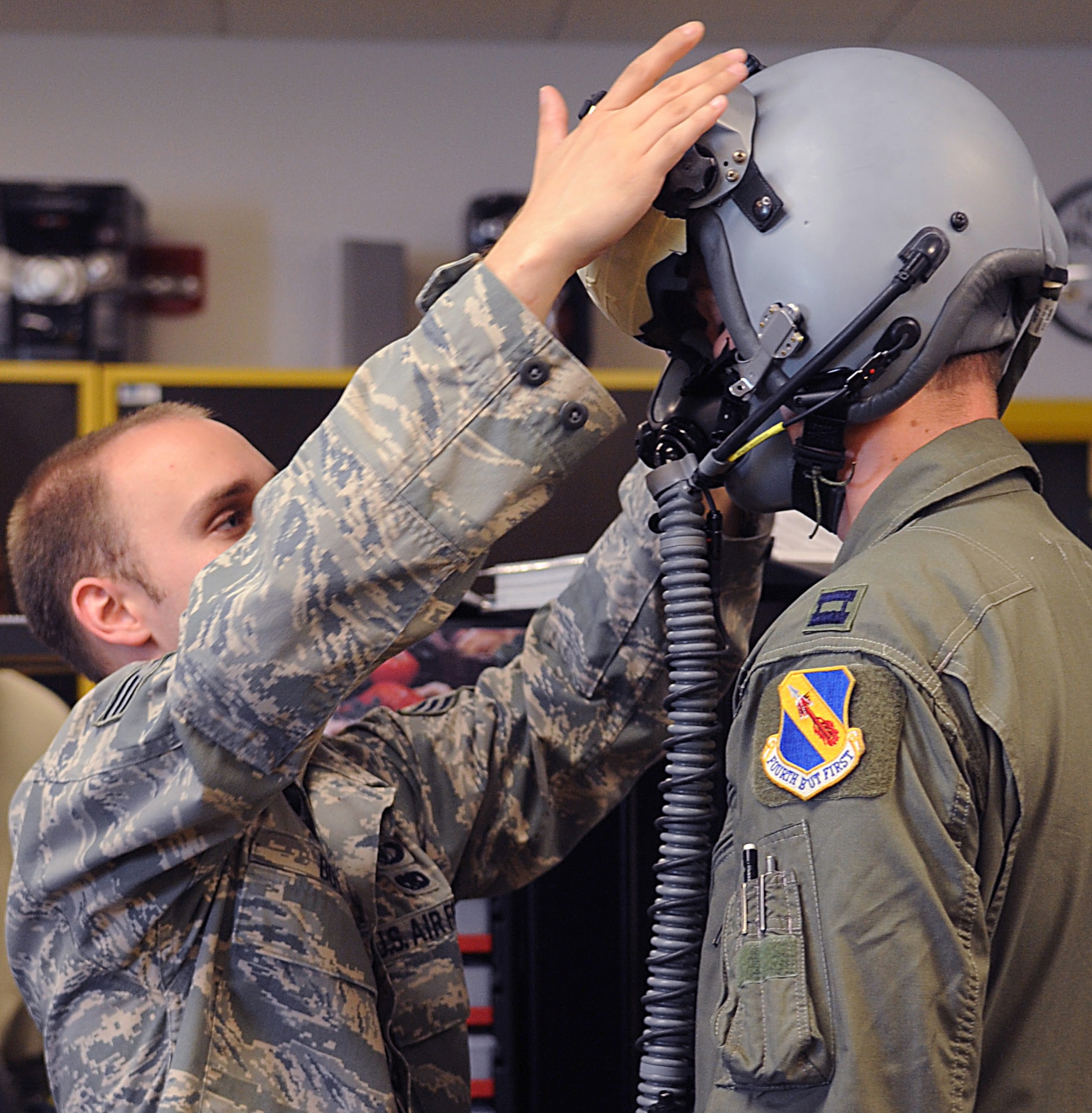 SEYMOUR JOHNSON AIR FORCE BASE, N.C. – Senior Airman Kevin Boyne custom fits Capt. Dan Olthoff’s Joint Helmet-Mounted Cueing System here Aug. 9, 2010. The 4th Operations Support Squadron life support specialists fit each pilot with a JHMCS and visor guaranteeing a perfect  fit and also making the helmet more comfortable and light weight. Airman Boyne, 4th Operations Support Squadron aircrew flight equipment craftsman, is from Charlotte. Captain Oltthoff, 336th Fighter Squadron F-15 E Strike Eagle pilot, is from Atlanta. (U.S. Air Force photo/Senior Airman Makenzie Lang)