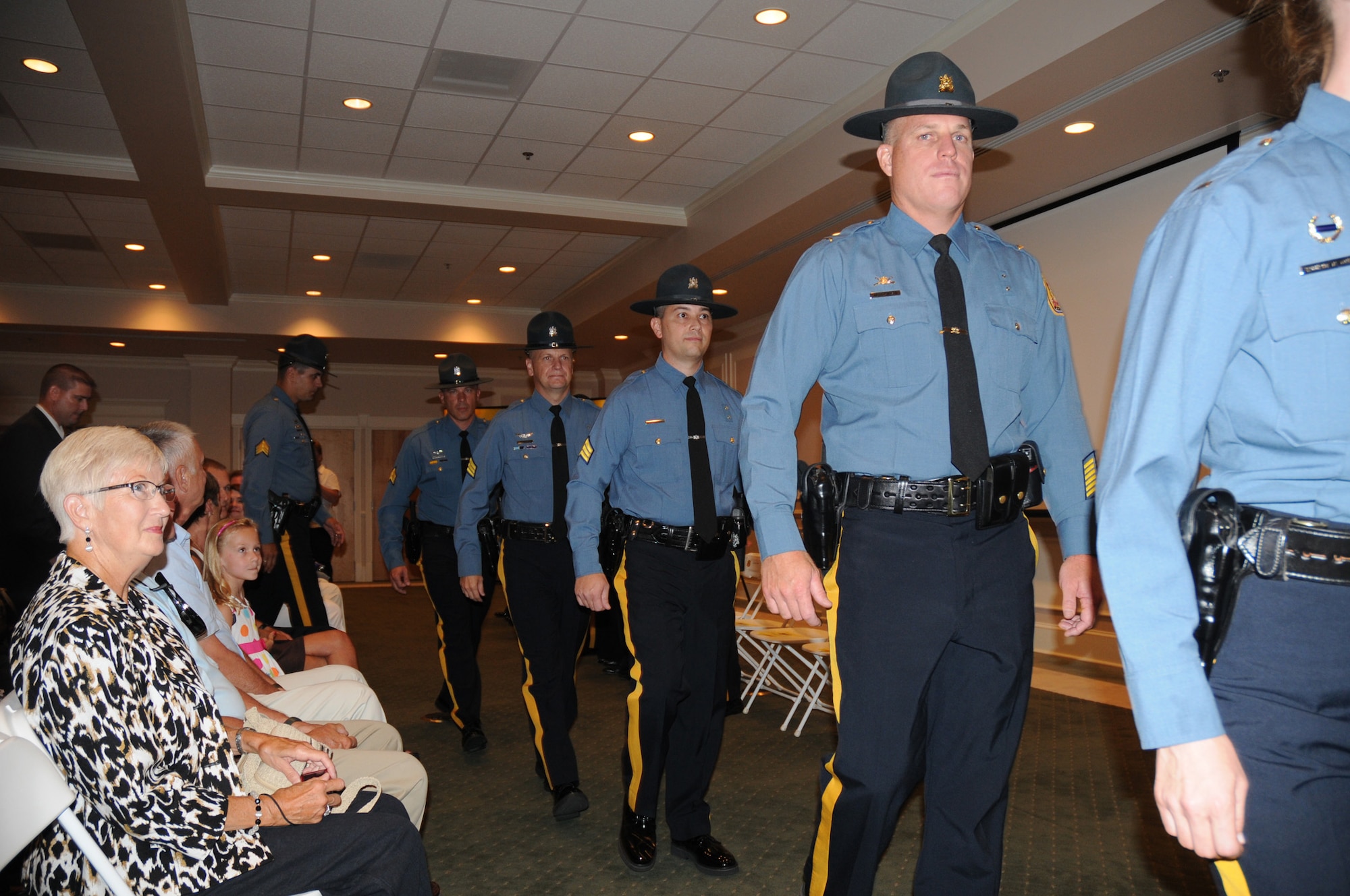 DOVER, Del.- Delaware State Police troopers arrive for their promotions at a ceremony held at Wilmington University here, Aug. 11, 2010. Col. Robert M. Coupe, Delaware State Police superintendent, who gave his remarks at the event, is 512th Airlift Wing Commander Col. Randal L. Bright's Honorary Commander. Colonel Bright was also in attendence. (U.S. Air Force photo/Capt. Marnee A.C. Losurdo)