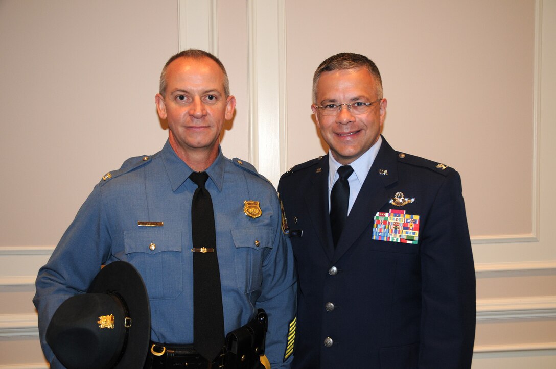 DOVER, Del.- Col. Robert M. Coupe (left), Delaware State Police superintendent, and Col. Randal L. Bright, 512th Airlift Wing commander, attended the Delaware State Police Promotion Ceremony Aug. 11, 2010 at Wilmington University here. Colonel Coupe is Colonel Bright's Honorary Commander. (U.S. Air Force photo/Capt. Marnee A.C. Losurdo)