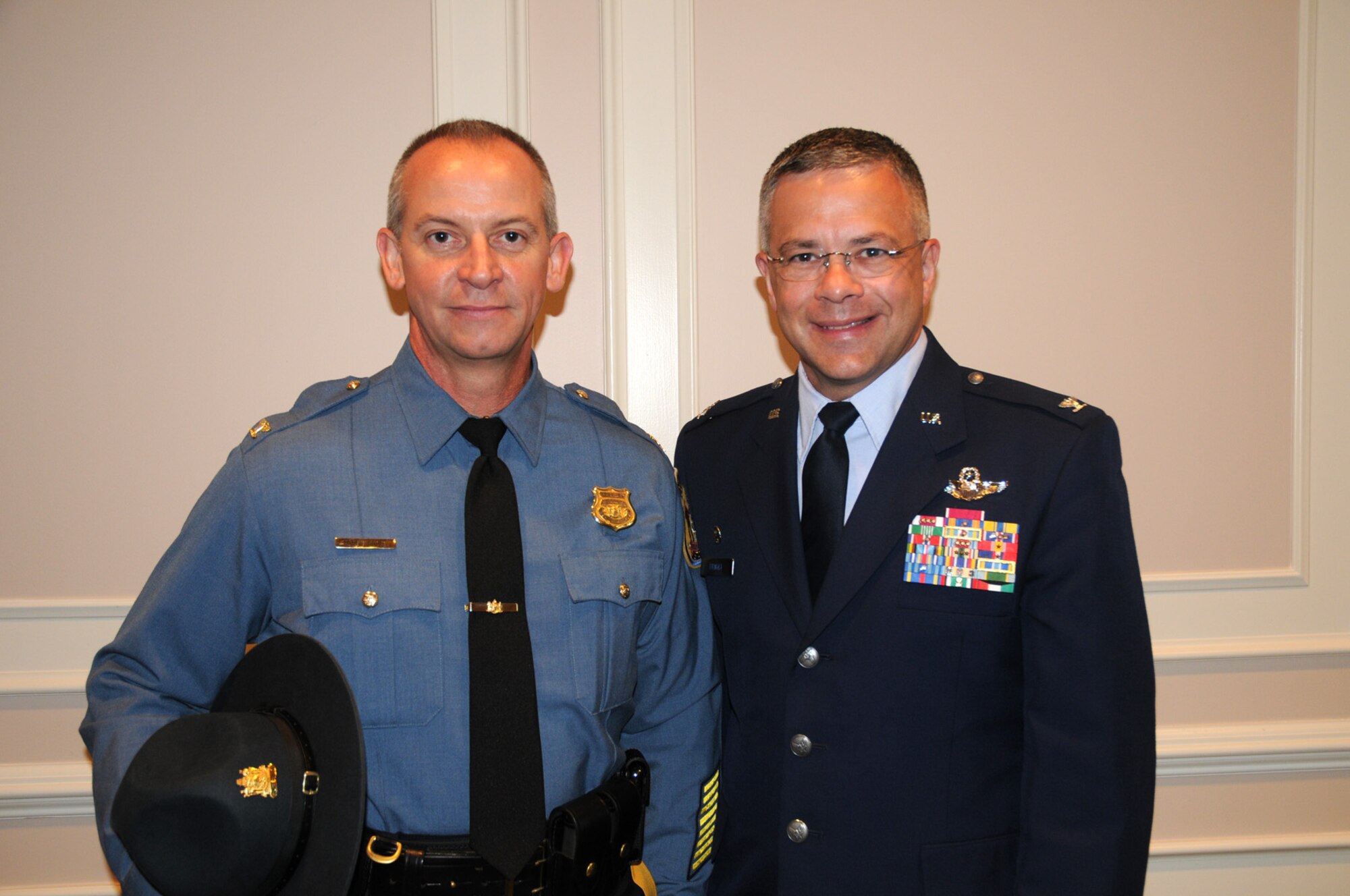 DOVER, Del.- Col. Robert M. Coupe (left), Delaware State Police superintendent, and Col. Randal L. Bright, 512th Airlift Wing commander, attended the Delaware State Police Promotion Ceremony Aug. 11, 2010 at Wilmington University here. Colonel Coupe is Colonel Bright's Honorary Commander. (U.S. Air Force photo/Capt. Marnee A.C. Losurdo)