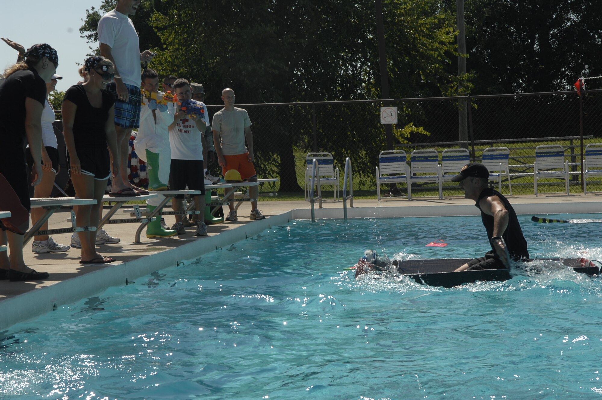 SCOTT AIR FORCE BASE, Ill. -- Al Bromley, Health and Wellness Center team, wins the race.  Teams had to race to the end of the pool and back to win. (U.S. Air Force Photo by Alice Munoz-Cook)
