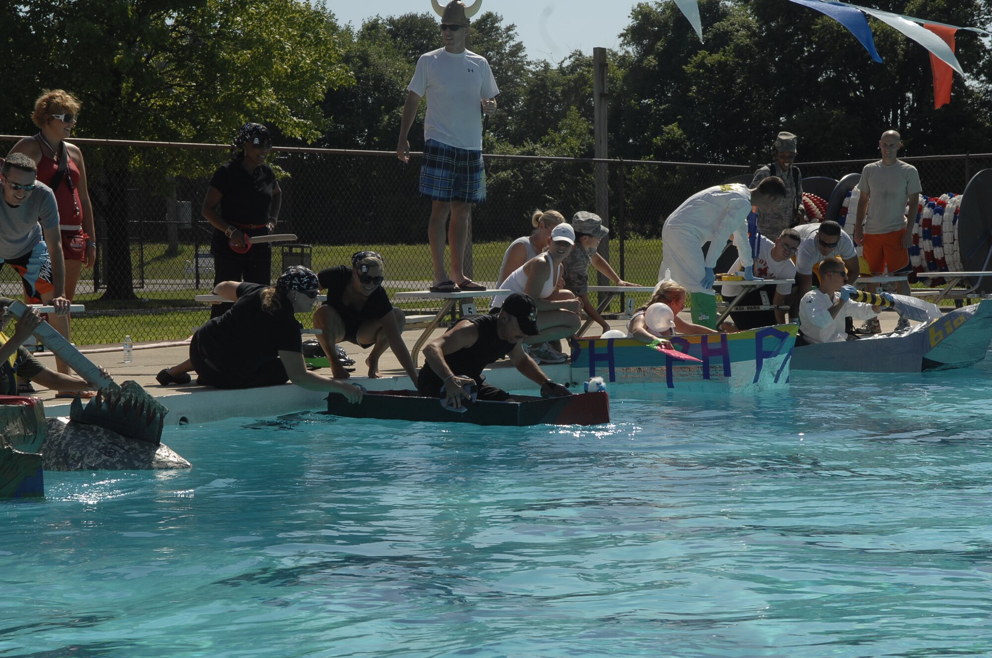 SCOTT AIR FORCE BASE, Ill. -- Teams competing in the 375th Medical Group duct tape regatta prepare to launch their boats into the James Gym pool Aug. 4. Teams from the 375th MDG built boats made of duct tape and cardboard in the weeks leading up to the competition.(U.S. Air Force Photo by Alice Munoz-Cook)
