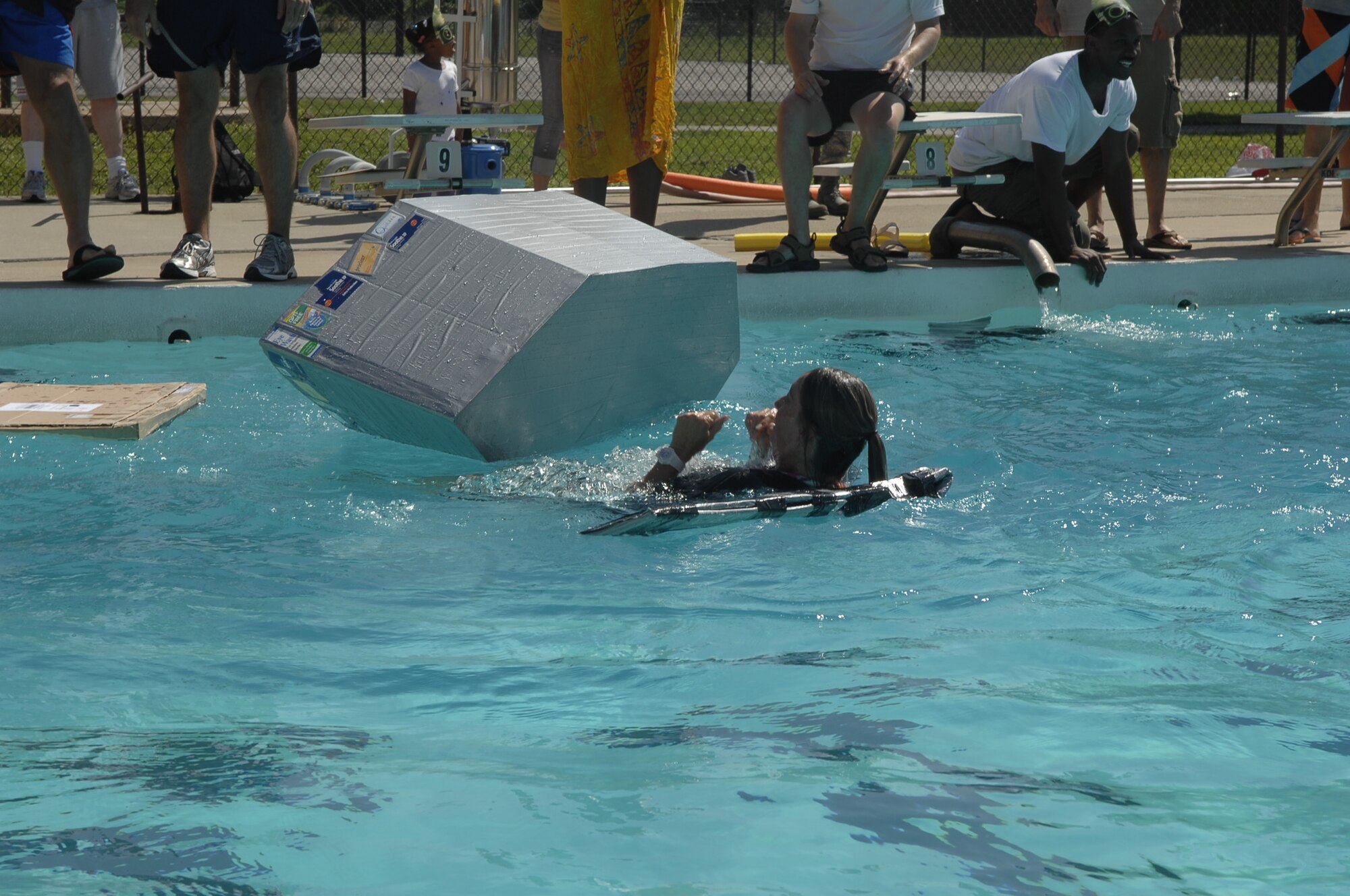 SCOTT AIR FORCE BASE, Ill. -- Gerri Bradley, from the optometry team, flips her boat during the duct tape regatta.  Seven teams competed in what the 375th MDG hopes will become an annual competition. (U.S. Air Force Photo by Alice Munoz-Cook)
