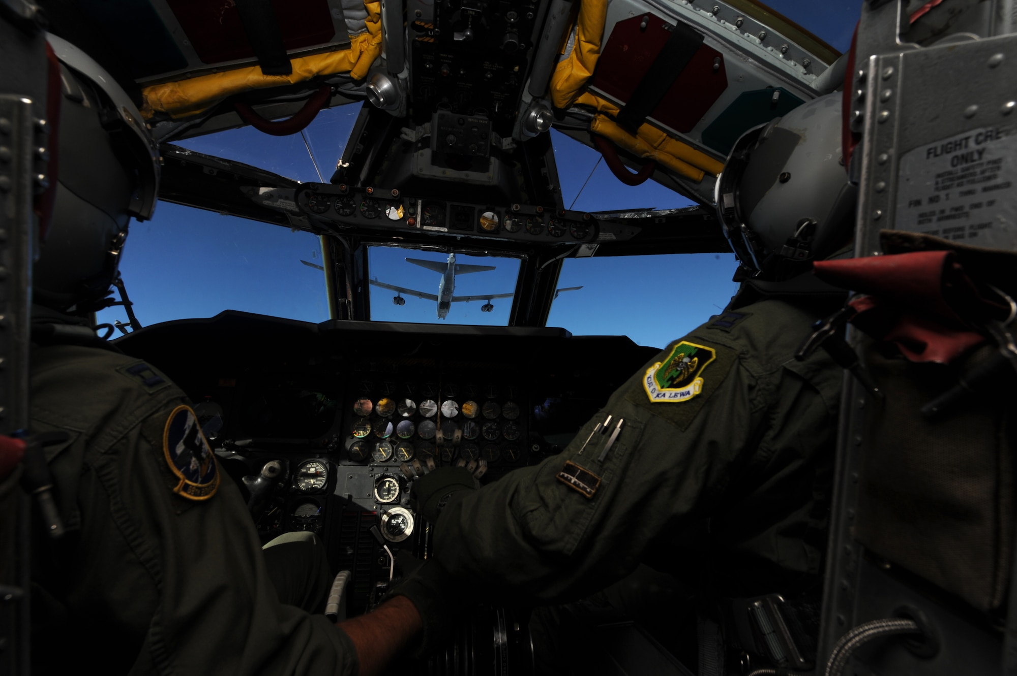 MINOT AIR FORCE BASE, N.D. -- Capt. Earl Schaller, pilot, and Capt. Brandon Wheeler, co-pilot, both from the 69th Bomb Squadron, move into position behind another B-52H Stratofortress during a training mission here Aug. 4. The 69th BS is the newest of the four B-52 Squadrons and train to ensure superior technical and weapons system expertise. (U.S. Air Force photo by Tech. Sgt. Lee A. Osberry Jr.)