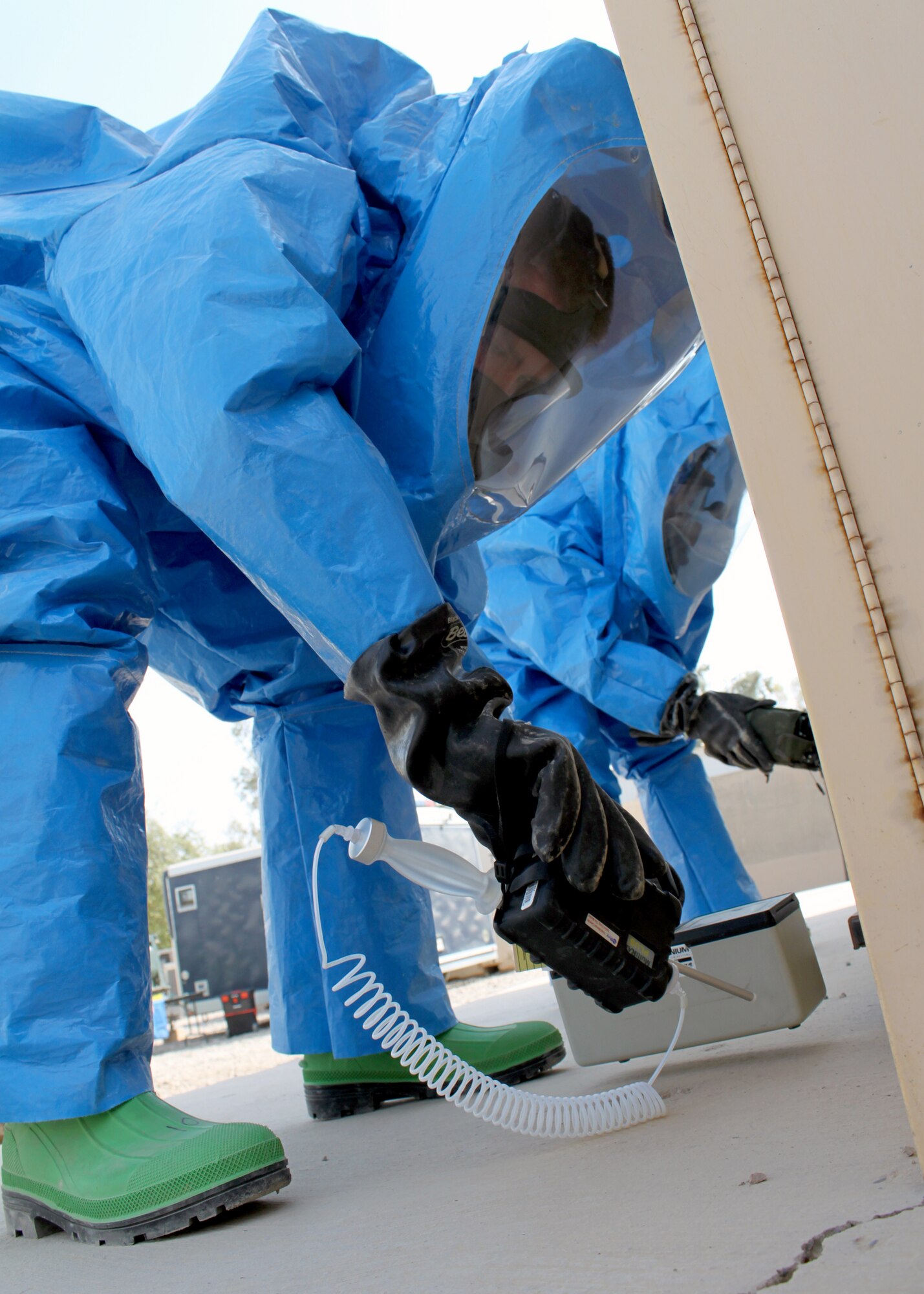 Senior Airmen Nathan Krajcirik (left) and Nadege James conduct training using a variety of equipment Aug. 3, 2010, at Joint Base Balad, Iraq. The Airmen of the Emergency management section test for chemicals, biological agents or nuclear materials in any form. Airmen Krajcirik and James are 332nd Civil Engineer Squadron Emergency Management Section technicians. (U.S. Air Force photo/Staff Sgt. Stacy Fowler) 