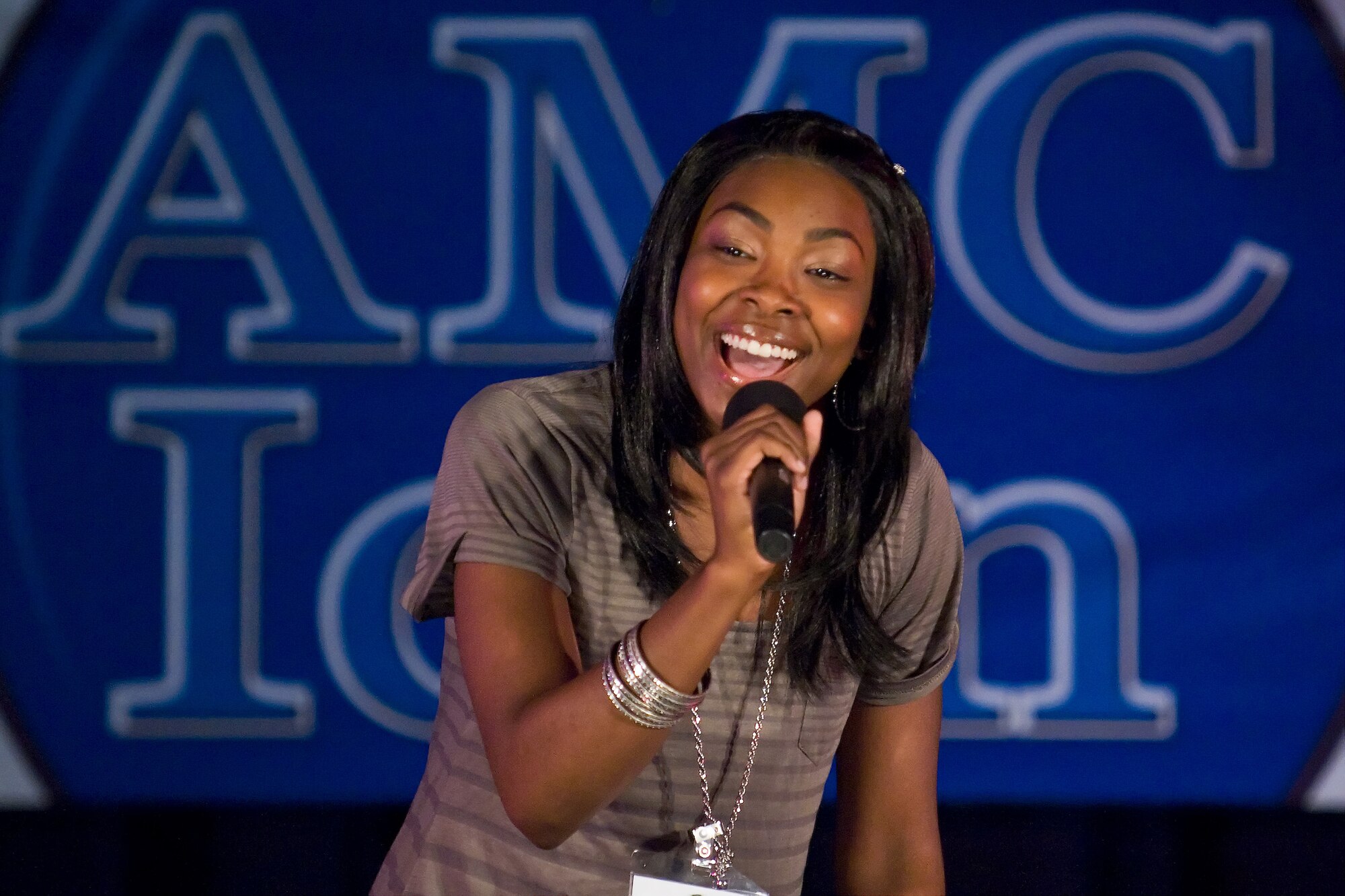 Airman 1st Class Ramia Myles, 436th Aerial Port Squadron, performs during the Air Mobility Command Icon event at The Landings Club Aug. 5, 2010. Airman Long was one of 11 AMC Icon contestants that competed during this year?s event. (U.S. Air Force photo by Roland Balik/Released)