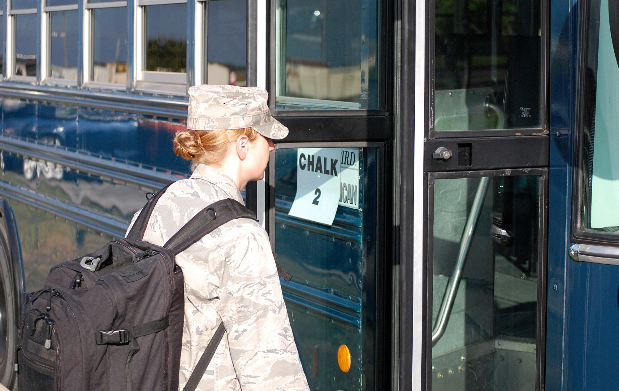 Capt. Rose Richeson, Air Education and Training Command Public Affairs Unit Deployment manager, boards the bus to the 902nd Logistics Readiness Squadron Deployment Processing Center on Randolph Air Force Base Aug. 10 during deployment exercise Joint Base San Antonio 10-08. More than 200 Airmen from different agencies on Randolph AFB participated in the two-day deployment exercise. (U.S. Air Force photo/Master Sgt. Paul Kilgallon)