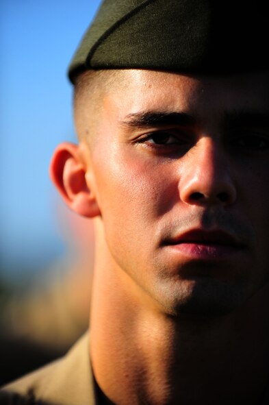 DYESS AIR FORCE BASE, Texas -- Marine Cpl. Colbi Stowers, Corporals Course student, prepares to be inspected by his instructor here Aug. 5. Twenty-eight Marine corporals stood in formation on the fitness center football field to be inspected in their uniforms by instructors. The Marine’s Enlisted Professional Military Education course, known as “Corporals Course," commenced for the first time at Dyess. The 16-day course teaches young Marine NCOs (corporals) how to lead in today’s Marine Corps in garrison and in theater. (U.S. Air Force photo/Senior Airman Domonique Washington)