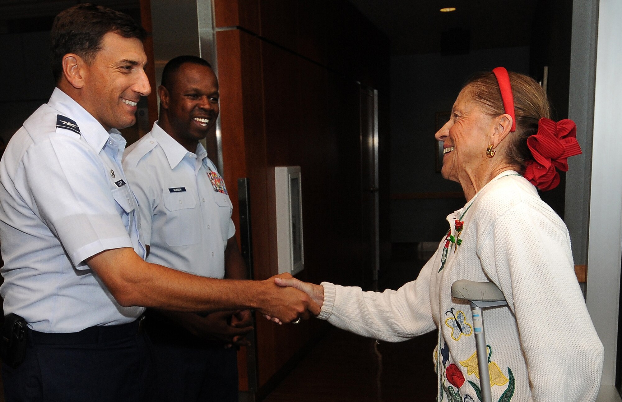 Col. Rick LoCastro and Chief Master Sgt. Stef Dunson welcome Sue Graham to the High Country Inn dining facility at the Air Force Academy for lunch Aug. 9, 2010. Retirees, their spouses and enlisted Airmen may now eat lunch at the dining facility weekdays from 12:10 to 12:40 p.m. or as the Academy Preparatory School's school schedule permits. Colonel LoCastro is the 10th Air Base Wing commander, and Chief Dunson is the 10th ABW superintendent. (U.S. Air Force photo/Rachel Boettcher)