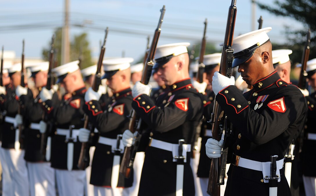 Lance Cpl. Carlton Williams performs inspection arms following a performance of the U.S. Marine Corps Silent Drill Platoon at Naval Air Station Patuxent River, Md., May 26, 2010. The Silent Drill Platoon will perform at the McConnell Open House and Air Show Sept. 25-26, along with other military and civilian acts.  (U.S. Marine Corps photo/Cpl. Bobby J. Yarbrough)