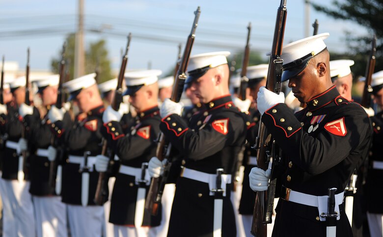 Lance Cpl. Carlton Williams performs inspection arms following a performance of the U.S. Marine Corps Silent Drill Platoon at Naval Air Station Patuxent River, Md., May 26, 2010. The Silent Drill Platoon will perform at the McConnell Open House and Air Show Sept. 25-26, along with other military and civilian acts.  (U.S. Marine Corps photo/Cpl. Bobby J. Yarbrough)