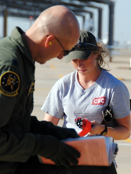 Aven Sanders, a summer-hire crew chief with CSC Applied Technologies at Vance AFB, conducts a T-38 Talon pre-flight with Lt. Col. Patrick “Pigs” Sanders, a T-38 instructor pilot with the 5th Flying Training Squadron -- and also Aven’s father. She had the opportunity to launch her father’s jet several times during her temporary summer job at the base. (U.S. Air Force photo/ Joe B. Wiles)