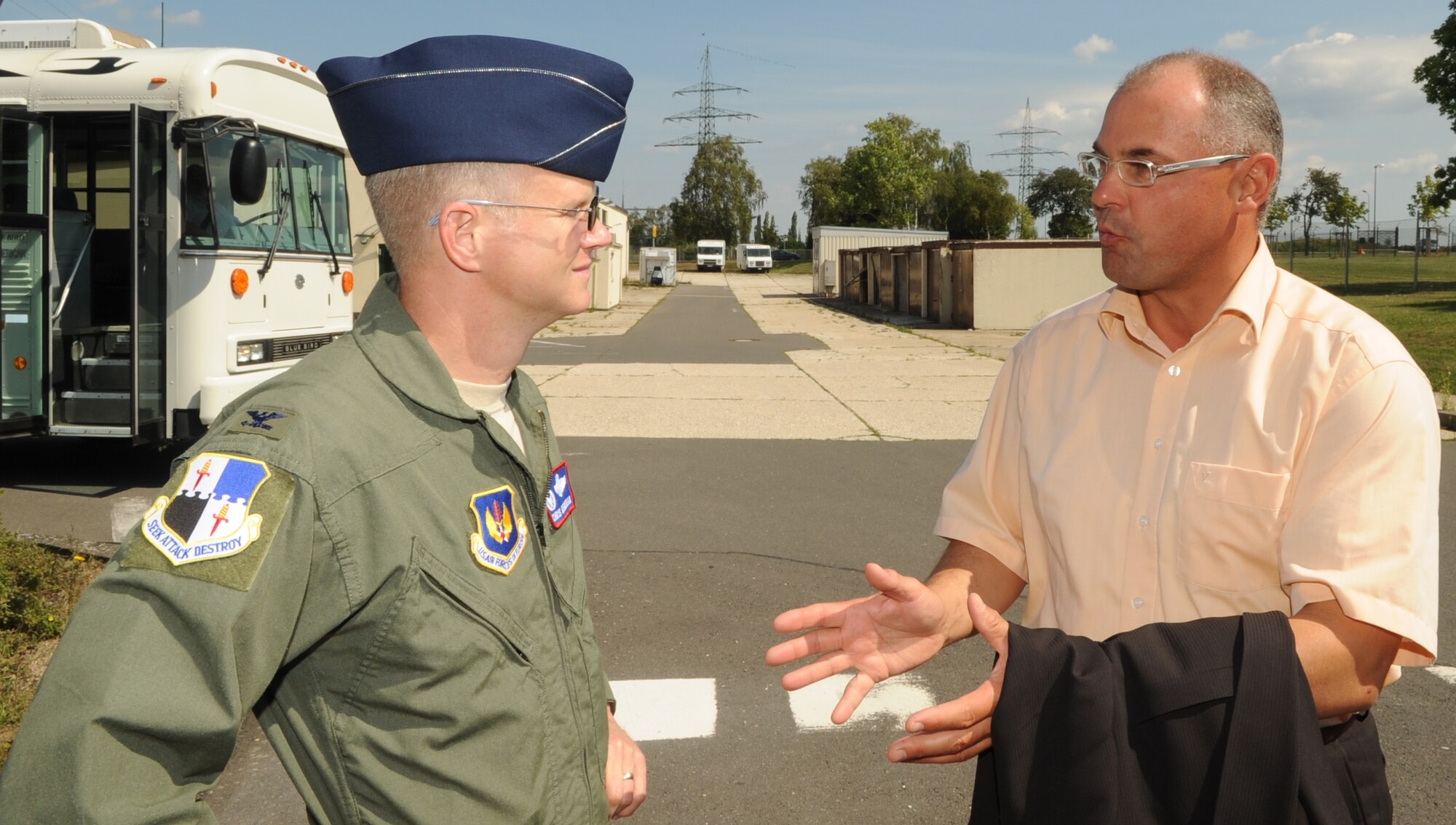 BITBURG AIR BASE, Germany – Mr. Helmut Berscheid, Bitburg Air base conversion development manager, speaks with Col. Christopher P. Weggeman, 52nd Fighter Wing Commander,  after a base tour Aug. 10. Colonel Weggeman and Mr. Berscheid toured various facilities to determine whether the buildings would be suitable for future use by the city of Bitburg. (U.S. Air Force photo/Senior Airman Nick Wilson)