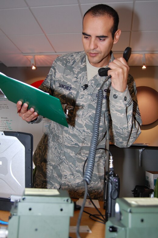 Tech. Sgt. Sergio Sanchez, 555th Fighter Squadron aviation management, communicates with a pilot coming back from a mission Aug. 6, 2010 at Kallax Air Base, Sweden The 555th FS spent two weeks working with the Swedish air force at Norrbotten Wing conducting air-to-air and air-to-ground training missions. (U.S. Air Force photo by Tech. Sgt. Lindsey Maurice/Released)