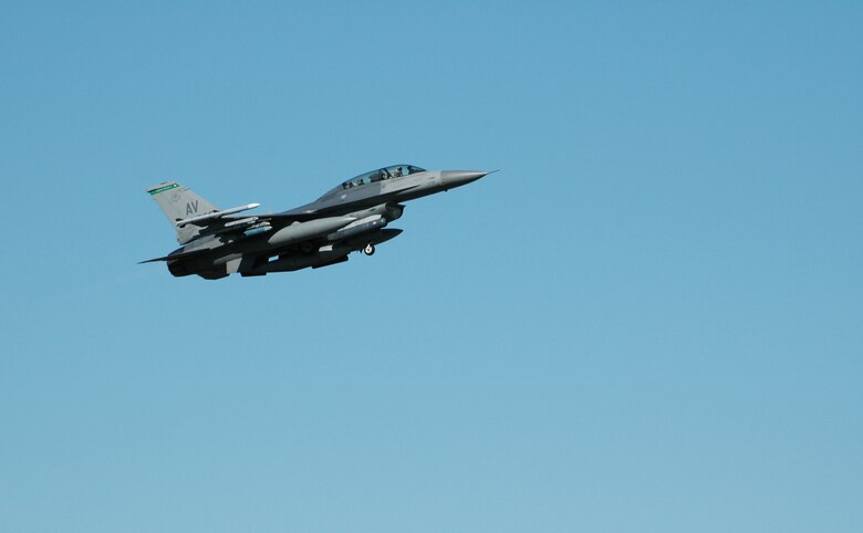 An Aviano Airman enjoys a familiarization flight in an F-16 D-model during a training exercise Aug. 5, 2010 at Kallax Air Base, Sweden. The 555th Fighter Squadron, based out of Aviano Air Base, Italy, spent two weeks working with the Swedish air force at Norrbotten Wing conducting air-to-air and air-to-ground training missions. (U.S. Air Force photo by Tech. Sgt. Lindsey Maurice/Released)