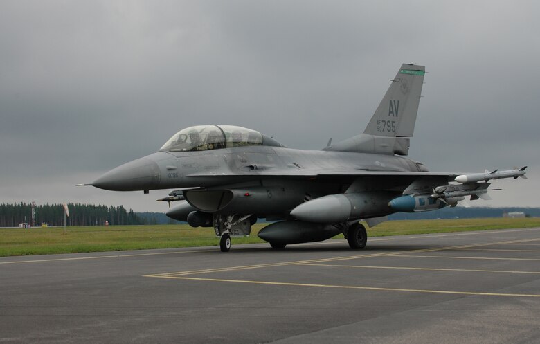 Capt. Ryan Thulin, 555th Fighter Squadron pilot, takes Staff Sgt. Darren Hale, 31st Aircraft Maintenance Squadron avionics systems journeyman, on a familiarization flight in an F-16 Aug. 4, 2010 at Kallax Air Base, Sweden. The 555th FS spent two weeks working with the Swedish air force members of Norrbotten Wing. (U.S. Air Force photo by Tech. Sgt. Lindsey Maurice/Released)