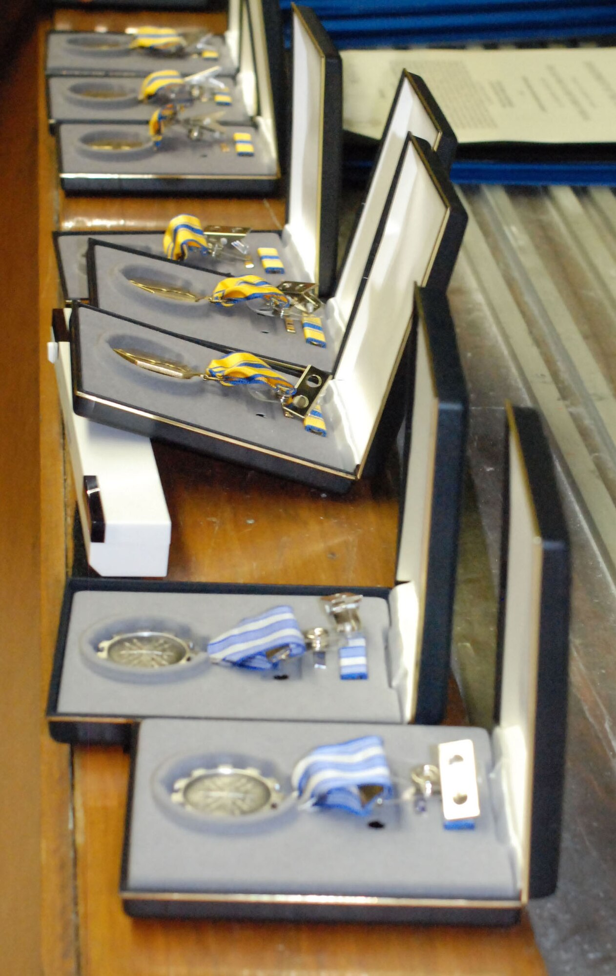 PATRICK AIR FORCE BASE, Fla. -- Air Force Achievement Medals (front) and Air Force Commendation Medals line the podium at the 308 Rescue Squadron here. Part of the 920th Rescue Wing, its Airmen engage in three of the Air Force Reserve's most cutting-edge and satisfying missions: combat search and rescue; space support; and humanitarian assistance. (U.S. Air Force photo/Staff Sgt. Ken Salgat)