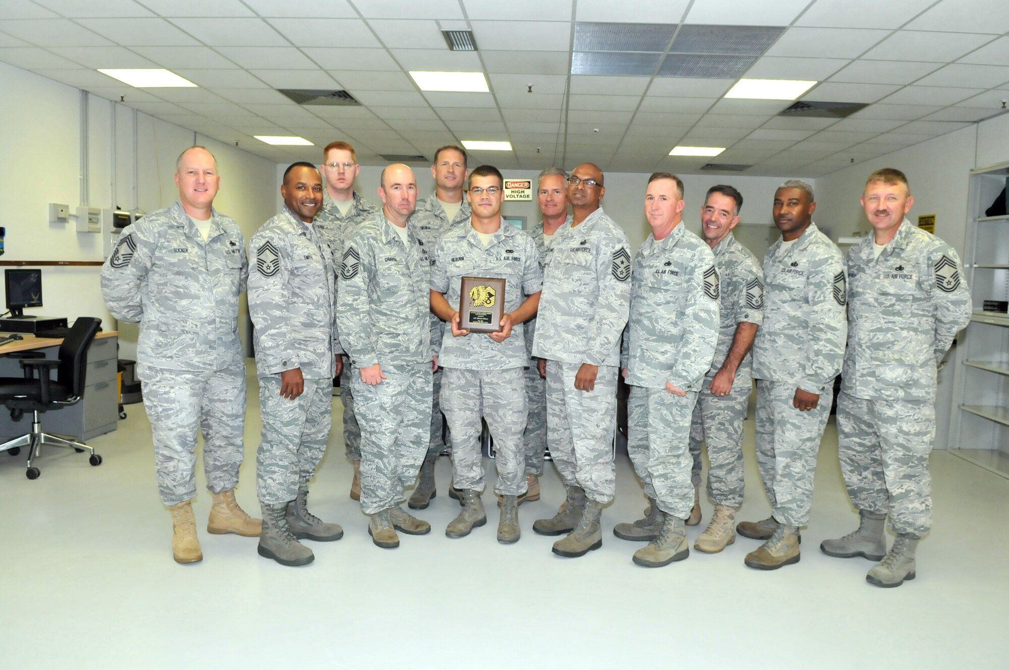 Airman 1st Class Michael Kilburn, 31st Maintenance Squadron avionics intermediate section journeyman, receives the Aviano Chiefs' Choice Award from the Aviano's Chiefs' Group Aug. 10. Aviano chiefs present the monthly award to an Airman who clearly exceeds Air Force standards in the areas of dress and appearance, bearing, and exceptional behavior in performance of their duties and in relationships with others. (U.S. Air Force photo/Staff Sgt. Mercedeskimble L. Crossland)