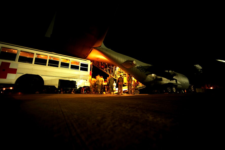 Airmen from the 332nd Medical Group Contingeny Aeromedical Staging Facility in medical vehicles pull up to transport patients to the Joint Base Balad, Iraq, theater hospital on July 17, 2010. (U.S. Air Force Photo/Staff Sgt. Andy M. Kin) 