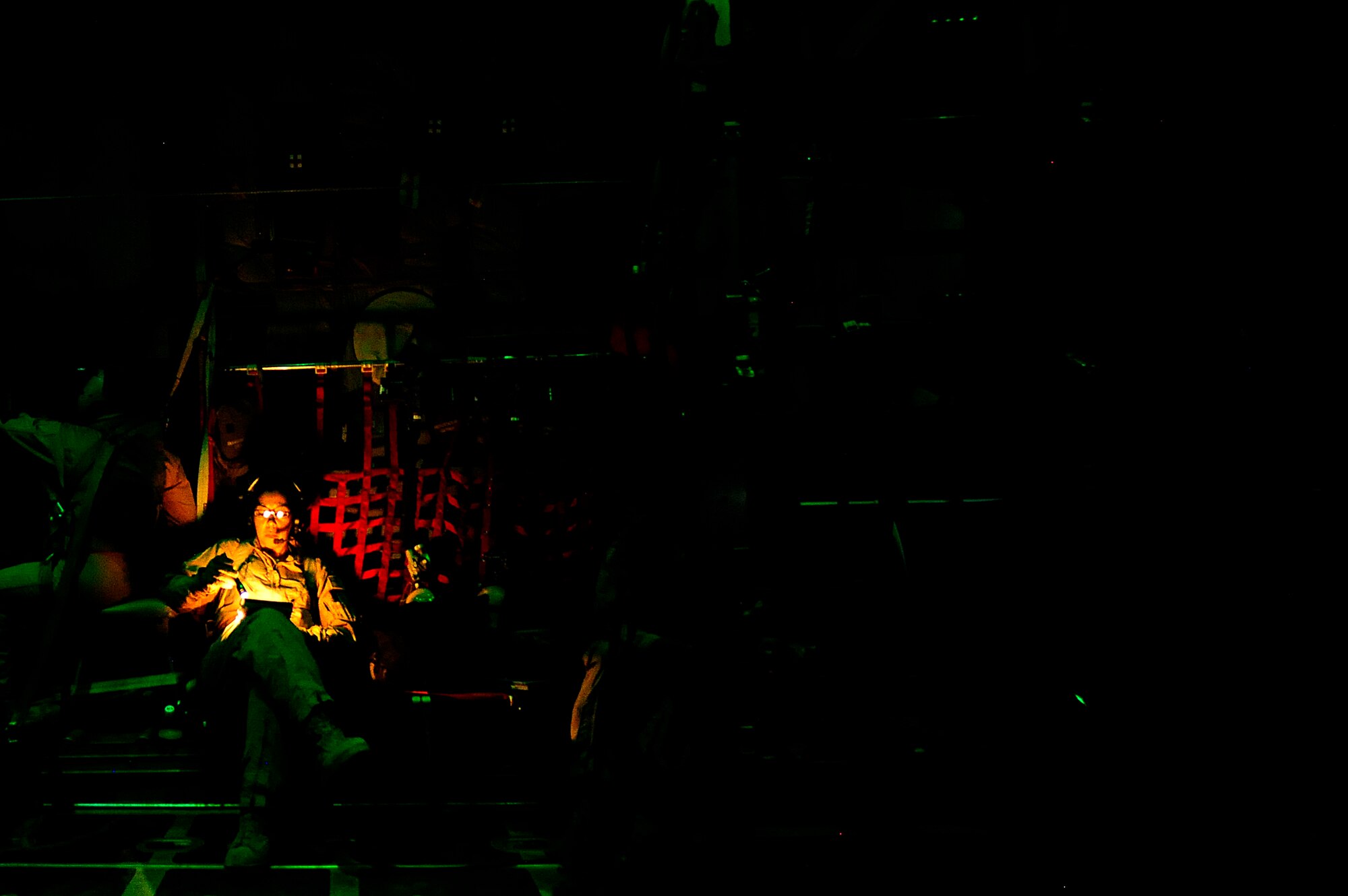 U.S. Air Force reservist Maj. Lisa Mayo a flight nurse assigned to the 362nd Expeditionary Aeromedical Evacuation Flight, looks over checklist during aeromedical mission aboard a C-130 Hercules aircraft at Joint Base Balad, Iraq on July 17, 2010. 
(U.S. Air Force photo by Staff Sgt. Andy M. Kin / Released)