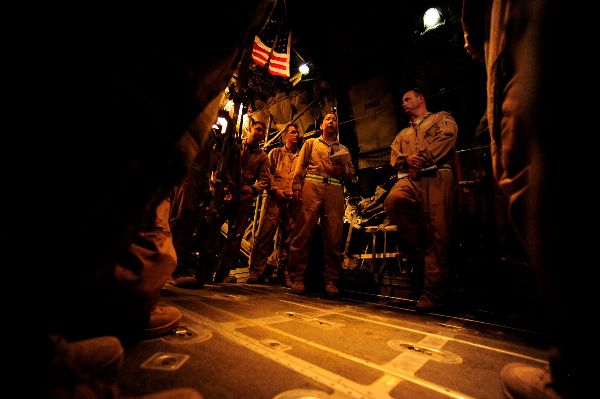 U.S. Air Force reservist Maj. Lisa Mayo a flight nurse assigned to the 362nd Expeditionary Aeromedical Evacuation Flight, briefs air crew on patient transit aboard a C-130 Hercules aircraft prior to an aeromedical mission at Joint Base Balad, Iraq on July 17, 2010. 
(U.S. Air Force photo by Staff Sgt. Andy M. Kin / Released)