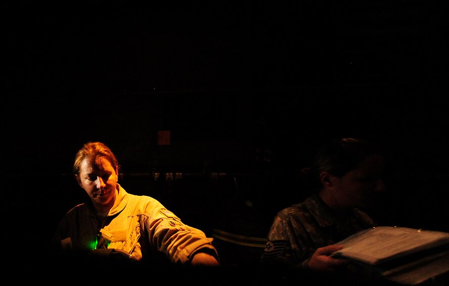 Tech Sgt. Margerite Hellwich, an aeromedical evacuation technician assigned to the 362nd Expeditionary Aeromedical Evacuation Flight, looks over medical supplies prior to an aeromedical flying mission aboard a C-130 Hercules aircraft at Joint Base Balad, Iraq, on July 17, 2010. (U.S. Air Force Photo/Staff Sgt. Andy M. Kin) 