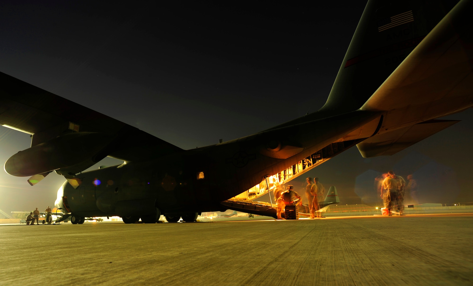 U.S. Air Force airmen of the 362nd Expeditionary Aeromedical Evacuation Flight, load a C-130 Hercules aircraft with all their medical gear for a aeromedical evacuation mission at Joint Base Balad, Iraq on July 17, 2010.
(U.S. Air Force photo by Staff Sgt. Andy M. Kin / Released)