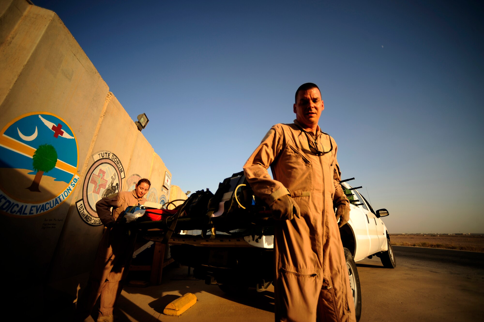 U.S. Air Force reservist Senior Master Sgt. Tony Staut and Tech Sgt. Margerite Hellwich, aeromedical evacuation technicians assigned to the 362nd Expeditionary Aeromedical Evacuation Flight, loads gear in pick up for transit to the plane prior to flying mission at Joint Base Balad, Iraq on July 17, 2010.
(U.S. Air Force photo by Staff Sgt. Andy M. Kin / Released)