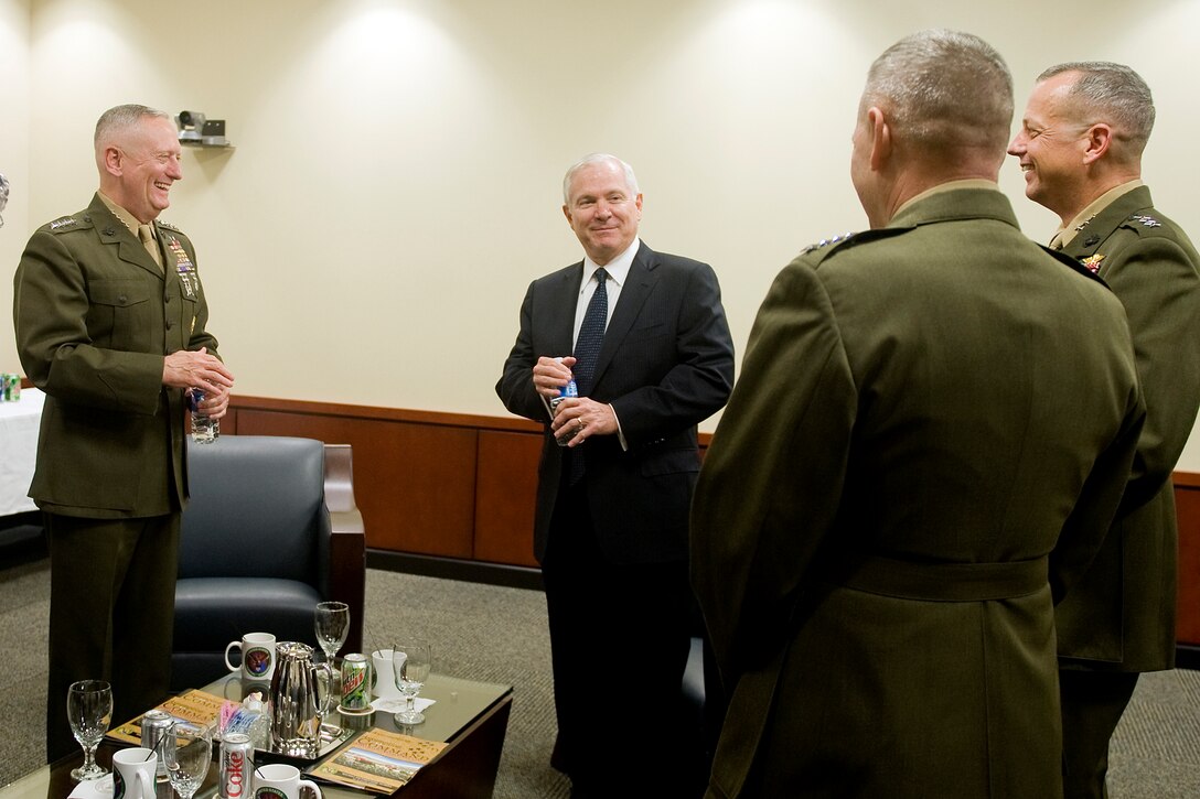 U.S. Defense Secretary Robert M. Gates, center, shares a laugh with Marine Gen. James Cartwright, vice chairman of the Joint Chiefs of Staff, second from right, and Marine Gen. James N. Mattis, left, incoming commander, prior to an assumption of command ceremony on MacDill Air Force Base, Fla., Aug. 11, 2010.
