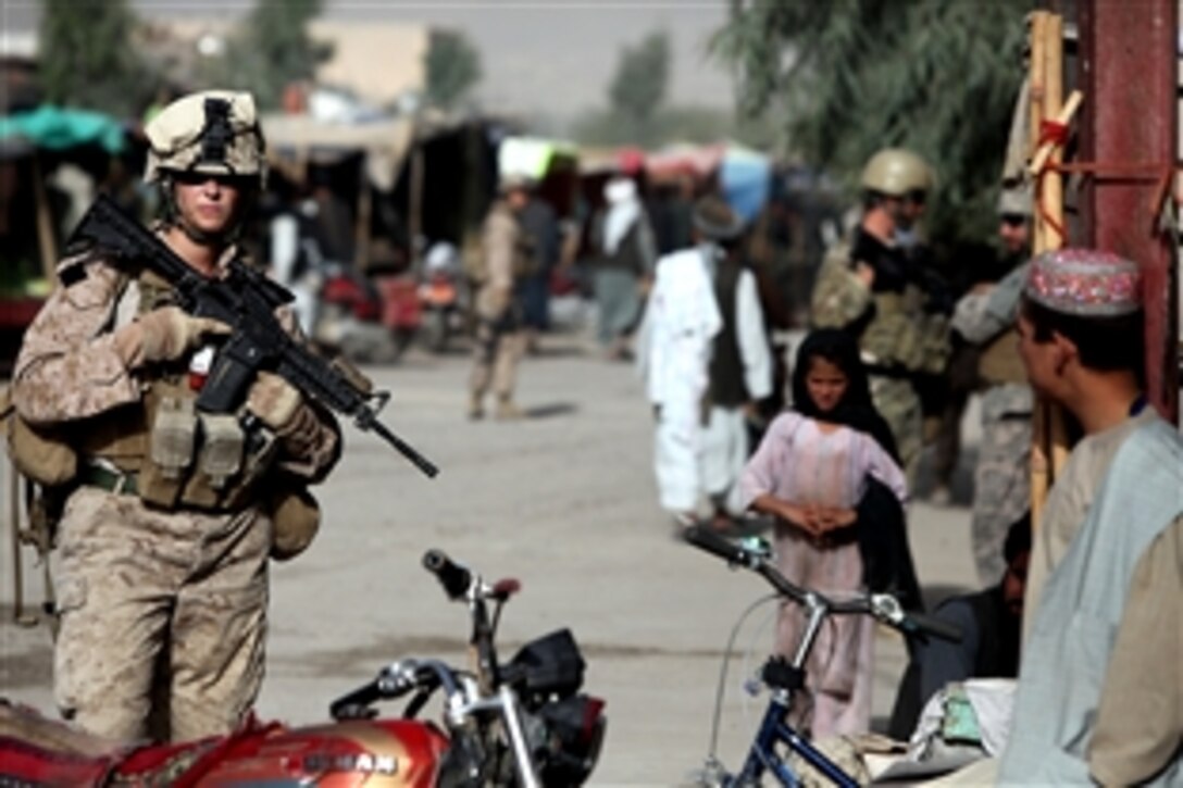 U.S. Navy Petty Officer 2nd Class Claire E. Ballante patrols in Musa Qa'leh, Afghanistan, Aug. 2, 2010. Ballante is with the 1st Battalion of the 2nd Marines. Members of the Female Engagement Team are building relationships with Afghan citizens by providing health assistance, hygiene supplies, and security to support the International Security Assistance Force.