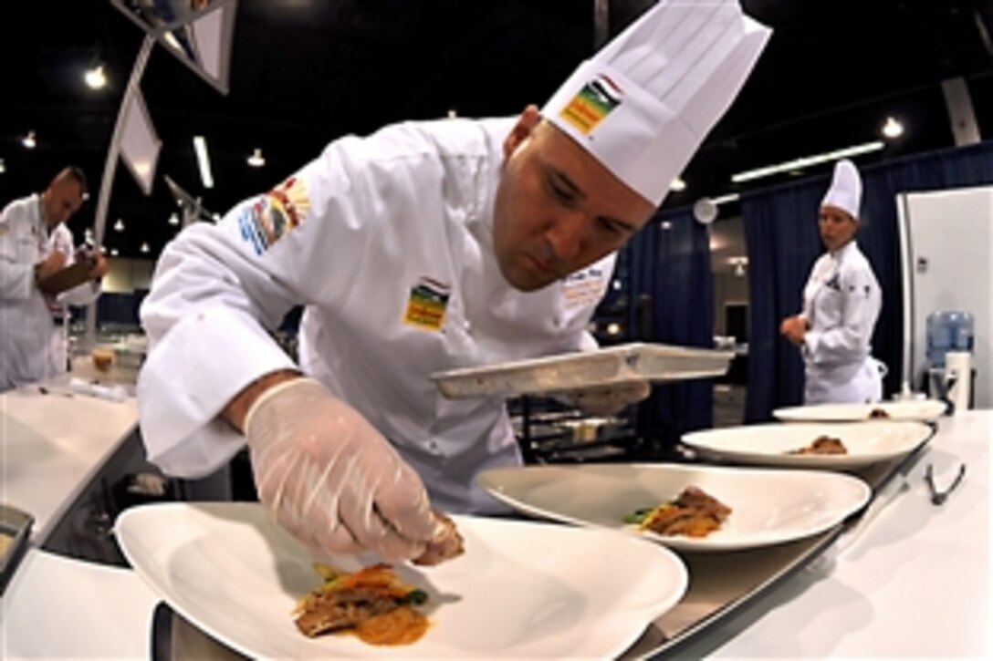 U.S Navy Chief Petty Officer Brandon Parry plates his main entree during the American Culinary Federation's Chef of the Year competition in Anaheim, Calif., Aug. 5, 2010. Parry is a culinary specialist assigned to the Commander of Naval Air Forces in San Diego. He is the first active-duty sailor to compete in the highly selective event.