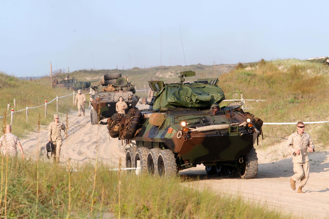 Marines with the 24th Marine Expeditionary Unit arrive and unload on Camp Lejeune's Onslow Beach, August 11. The Marines are returning from an seven month deployment. ::r::::n::