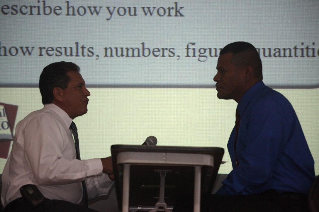 Gerardo Cruz (left), a veterans employment consultant with the North Carolina Employment Security Commission, conducts a mock interview with Staff Sgt. Mikkel Simpson (right), a diesel mechanic supervisor and a staff noncommissioned officer in charge with 2nd Maintenance Battalion, 2nd Marine Logistics Group, during a pre-separation seminar at the Russell Marine and Family Services Center aboard Marine Corps Base Camp Lejeune, recently.  Service members and families who are retiring or transitioning from the Marine Corps to the civilian world take courses and utilize resources offered through the Transition Assistance Management Program.