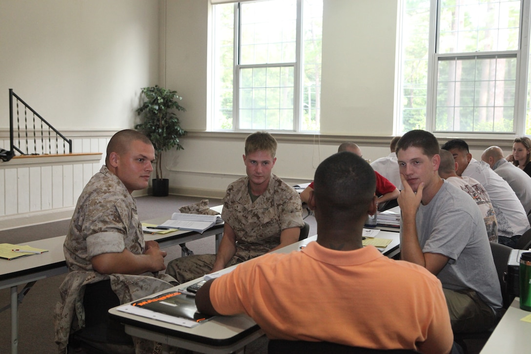Service members practice job interviewing techniques during a pre-separation seminar at the Russell Marine and Family Services Center aboard Marine Corps Base Camp Lejeune, recently.  The seminar is one of many resources offered through the Transition Assistance Management Program to help service members and families who are retiring or transitioning from the Marine Corps to civilian life.