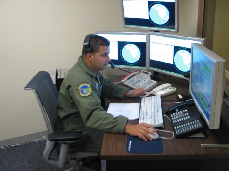 Senior Airman Eric Escobar, 7th Space Warning Squadron Beale Air Force Base, Calif, operates the training simulator during a monthly proficiency training session for one of five Missile Warning crews.  Training is performed using a simulator that mirrors the operations, allowing instructors to reproduce real world events for the crews to practice.  SrA Escobar monitors the actions taken by one of the crew members using the consoles on his left.  The console in front of him allows him to introduce stimuli to the trainees. Senior Airman Escobar won the Airman Category at the Air Force Level for the 2009 Space and Missile Operator of the Year / Enlisted Space Systems Operator of the Year Awards.