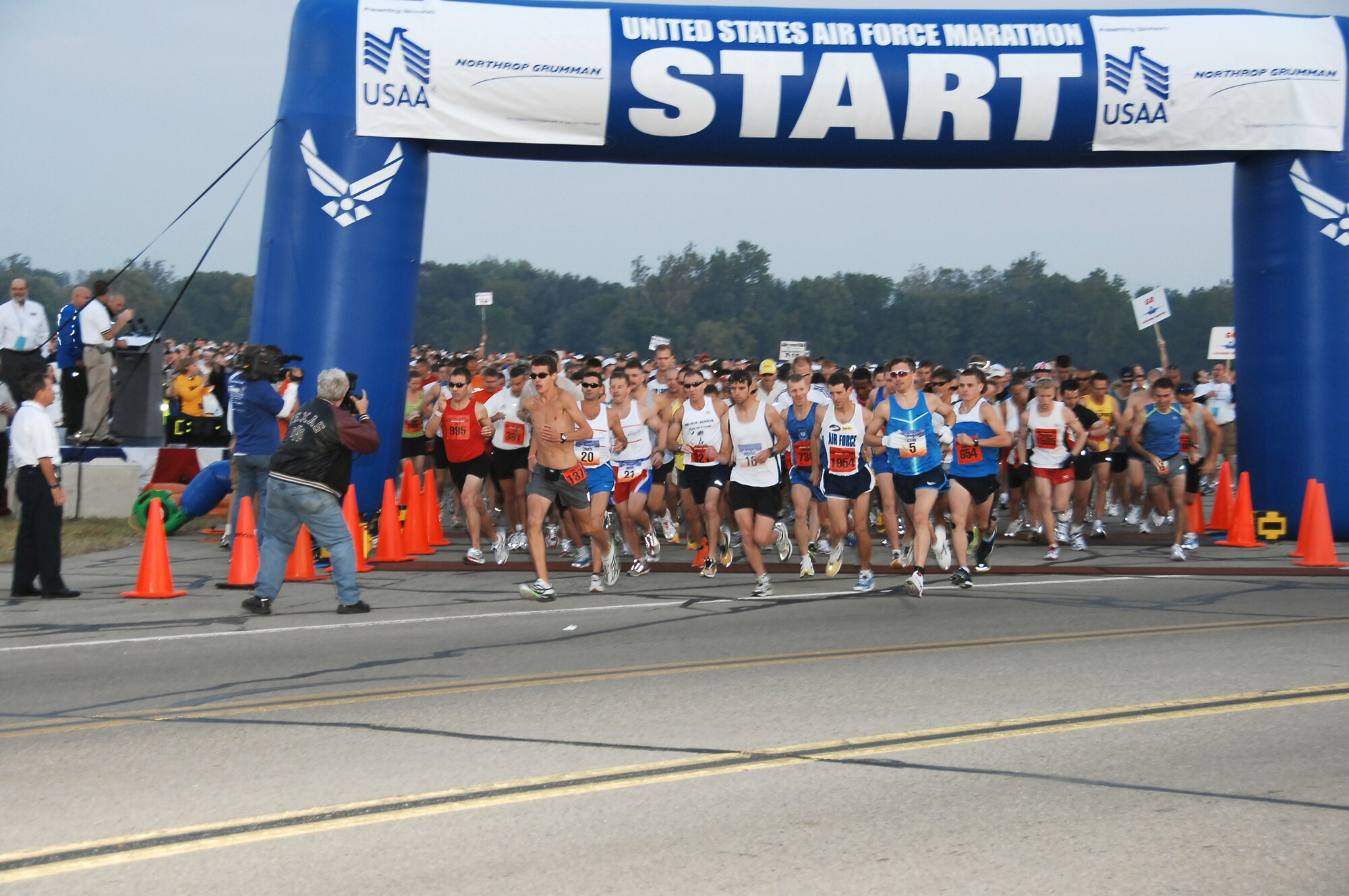 Runners take off at the starting line of the 2009 Air Force Marathon at Wright-Patterson AFB, Ohio, in this file photo. This year's 10,000th runner registered Aug. 12, 2010, meeting a long-standing event goal. (U.S. Air Force photo/Ben Strasser)
