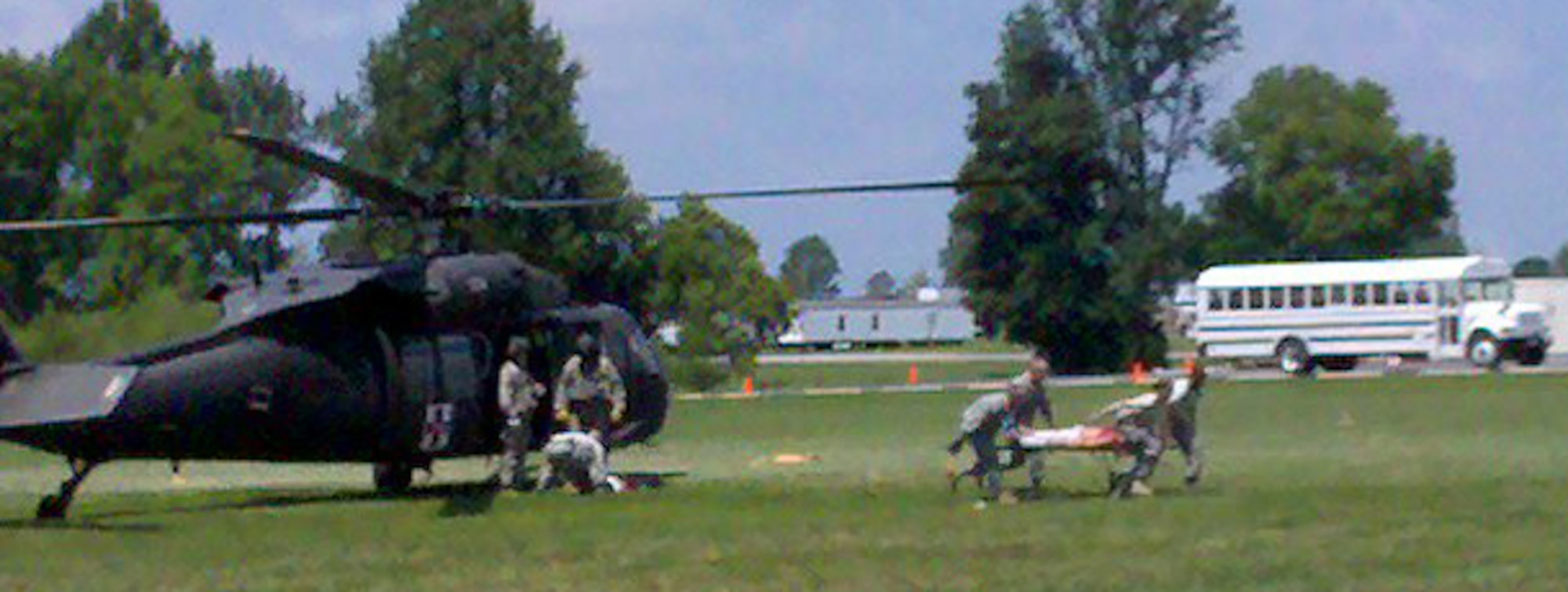 Medical personnel transport a simulated patient from a UH-60 Black hawk helicopter during Operation Vibrant Response, a training exercise held at Camp Atterbury, Indiana, July 12-22. (U.S. Air Force photo by Senior Master Sgt. Jeremy Rennahan)

